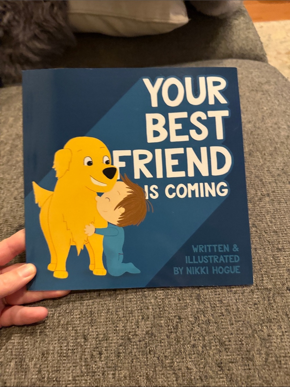 Your Best Friend is Coming baby book, with golden retriever